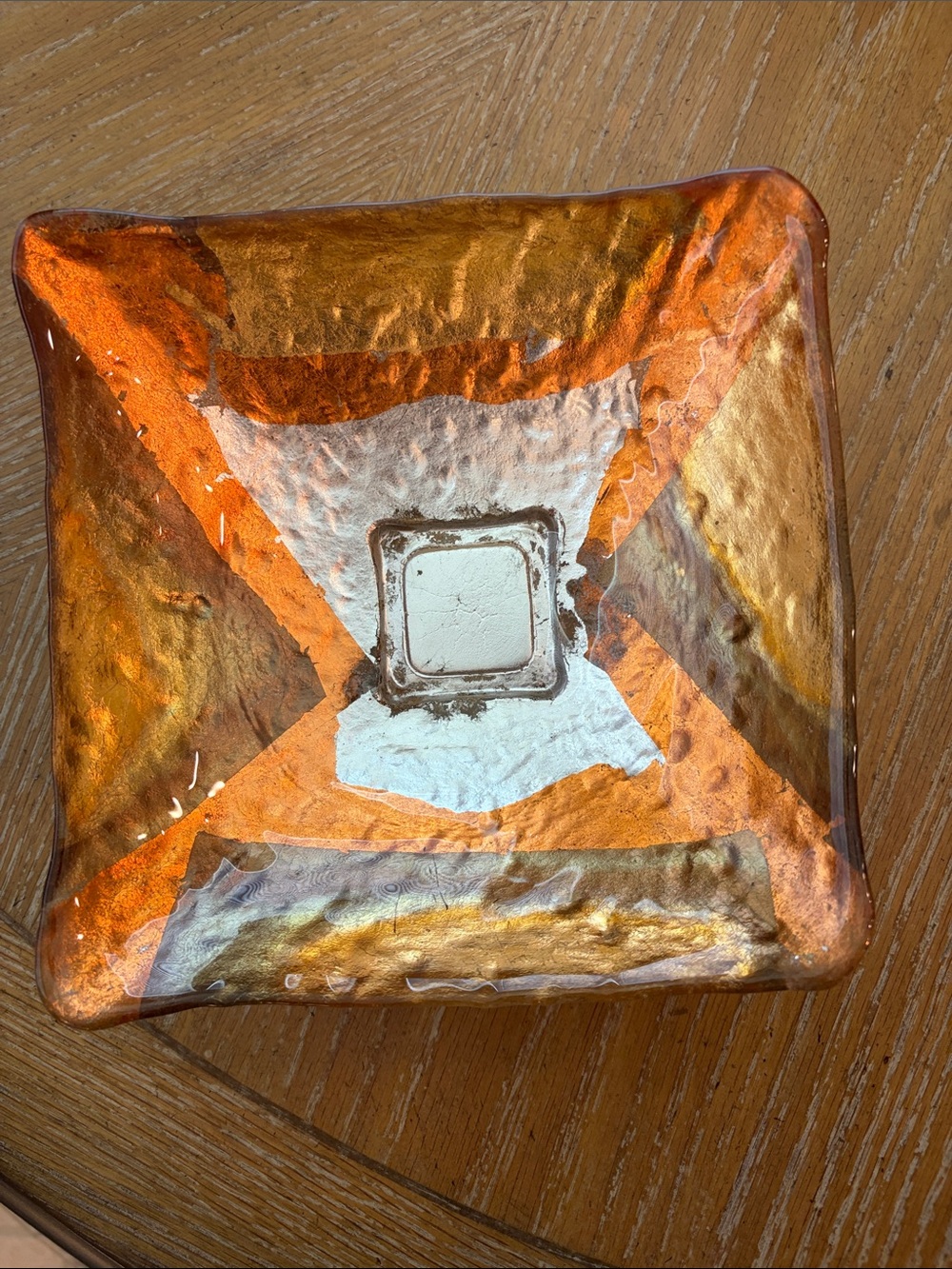 Square glass, abstract, orange, and brown bowl, witches 8“ x 8“.